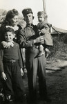 Postwar portrait of the Fainas family.

Pictured are Luba and Alexander Fainas with their sons Georges and Josie.