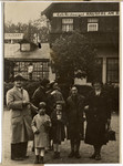 Austrian Jewish friends and family pose for a photograph in front of a restaurant in Vienna.