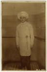 Portrait of Richard Wiener wearing a baker's hat for a costume ball.