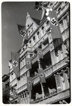 Swastikas hang from a building in Berlin. 

[This image from Germany was found in the P-20-1939 contact book]