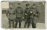 Group portrait of four POWs in Stalag 10 C.

Leopold Guttman is pictured second from the left.