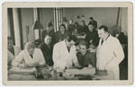 Group portrait of French survivors working in an ORT leather-making workshop.