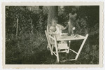 Doris Gutheim enjoys a picnic with her teddy bear.