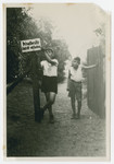 Two boys from Haus Berta, a summer camp sponsored by the Reich Federation of Jewish Front Soldiers, pose by a sign that states "Private Property: Entry Forbidden."