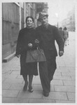 Maniefa and Shmuel Willenberg walk down a street of  Warsaw where they are living with false papers.