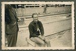 Argentinian swimmer Jeannette Morven Campbell sits by the side of the pool.