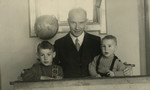 Portrait of a Dutch school teacher and his two sons.