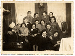 A group of young people pose together for a photograph.