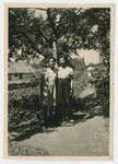 Marilyn and Jacky Johnson stand on the grounds of the Liebenau internment camp.