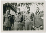 Two American soldiers pose with former members of the Wehrmacht

Norman Coulson is second from the left standing next to the other American soldier.