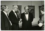 A group attends a reception in an art gallery.

Pictured are Chaim Perelman (second from the left) and Israeli General Moshe Dayan (third from the left).