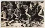 Men at work in one of the shoe factories of the Lodz ghetto.