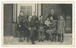Rabbi Yitzhak Jewdwab, his wife Lena and son Aaron pose with the family of their rescuers, the Wevers after liberation.