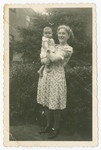Henny Wikkerink holds her foster brother, Aaron Jedwab, a Jewish infant in hiding as Jan Willem Herfstein.