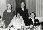 Ruth Eisenmann (Lange) poses with her rescuers at her wedding.