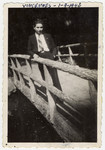Close-up portrait of Samual Schulman, a Jewish teenager born in America, standing on a bridge in Vincennes.