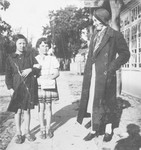 Niusia and Rywa Gordon pose with their aunt on a street in Swieciany.