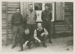 POWs pose outside a Red Cross building in Stalag Luft 1.