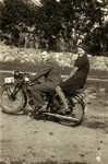 Wolf Godrov and his younger sister Sarah Rivka ride on a motorcycle.