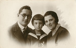 Studio portrait of Moshe Godroff and his wife Masha Gilerovich with their son Yaakov.