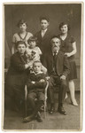 Ita and Don Mordechai Adam pose for a portrait with their children.