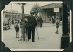 Children and adults gather on a street in the Ziegenhain displaced persons camp.