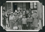 Members of the Frankfurt Jewish GI Council pose with children and women in the Ziegenhain displaced persons camp.