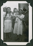 Group portrait of young women, one holding an infant, in the Ziegenhain displaced persons camp.