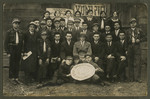 Asher Fetherhar (later Zidon) poses with members of the Hechalutz Mizrachi hachshara in Parczew.