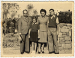 The Menn family poses by a stone wall in Tel Aviv where they settled after escaping from Lithuania.