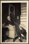 Photograph of Walter Lande seated in an interior.