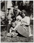 Oscar and Mizi Politzer pose in a garden with their two daughters Eva and Hedi.