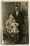 Studio portrait of  Mordechai, Feigele and their daughter (last name unknown).