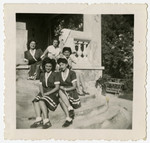 Five women sit together for a picture in Feldafing displaced persons camp.