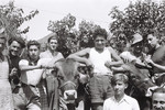 Group portrait of Zionist youth with their cow in a Hachshara near Milan.