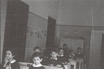 Children sit at their desks in an elementary school in Milan.