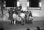 A group of children pose outside the children's home in Aspet, France.