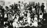 Children in the Humanistic school in Lublin, Poland pose for a group portrait in their Purim costumes.