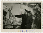 Sally Korn and a friend view a display of knitwear in the ORT exhibition in the Foehrenwald displaced person's camp.
