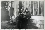 Camille Spira poses with her four children after crossing the border into Switzerland.