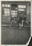 Annie rides a bicycle with her brother Robert on the back.