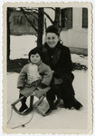 Sally Korn takes Abbie Fegerman sledding in the Foehrenwald displaced person's camp.
