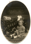 Four-year-old Marta van Collem poses with a stuffed animal.