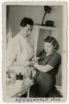 A woman receives medical treatment in the Foehrenwald displaced persons camp.