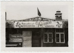 Exterior view of a barrack in the newly liberated Buchenwald bedecked with an anti-Nazi sign.