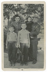 Postwar portrait of the Weinberg family.

Alter and Yitzchak Weinberg are in front.