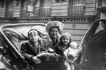 Gerdie Gartenberg takes her two newly adopted children, Ewa and Jacob, in a carriage ride through Paris prior to bringing them to the States.