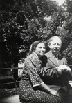 Dr. and Mrs. Josepovitz, the directors of the Fublaines Children's Home, sit on a bench outside the home.