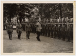 Adolf Hitler inspects members of the German labor force DAF.