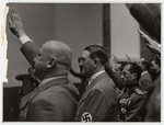 Adolph Hitler, Julius Streicher, and other Nazi officials offer a salute.